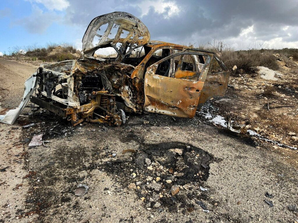 Al Jazeera's burnt-out car is seen at the site near the village of Alma al-Chaab, Lebanon, Oct. 15, 2023. (Reuters Photo)