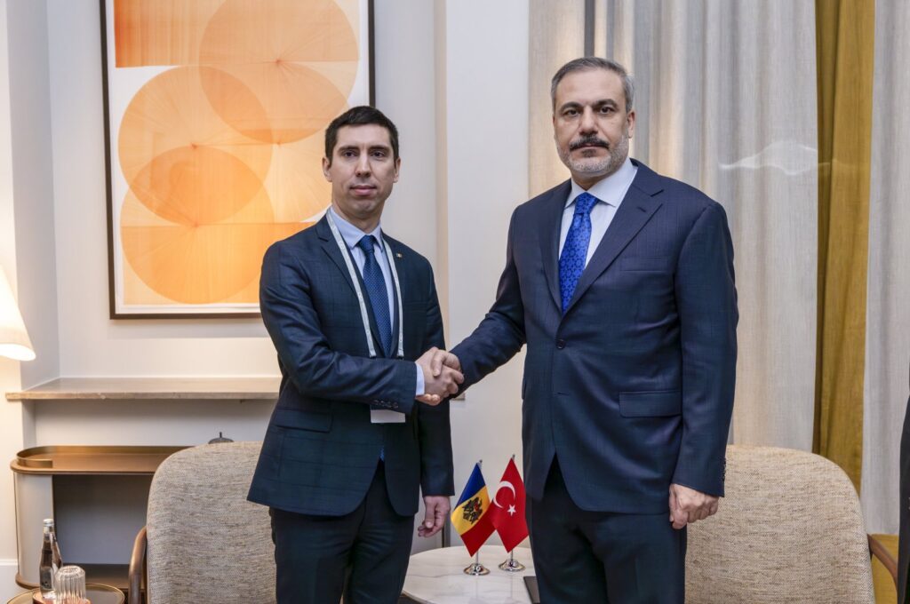 Moldova's Foreign Minister Mihai Popsoi (L) shakes hands with Foreign Minister Hakan Fidan during a meeting in Munich, Germany, Feb. 16, 2024. (AA Photo)