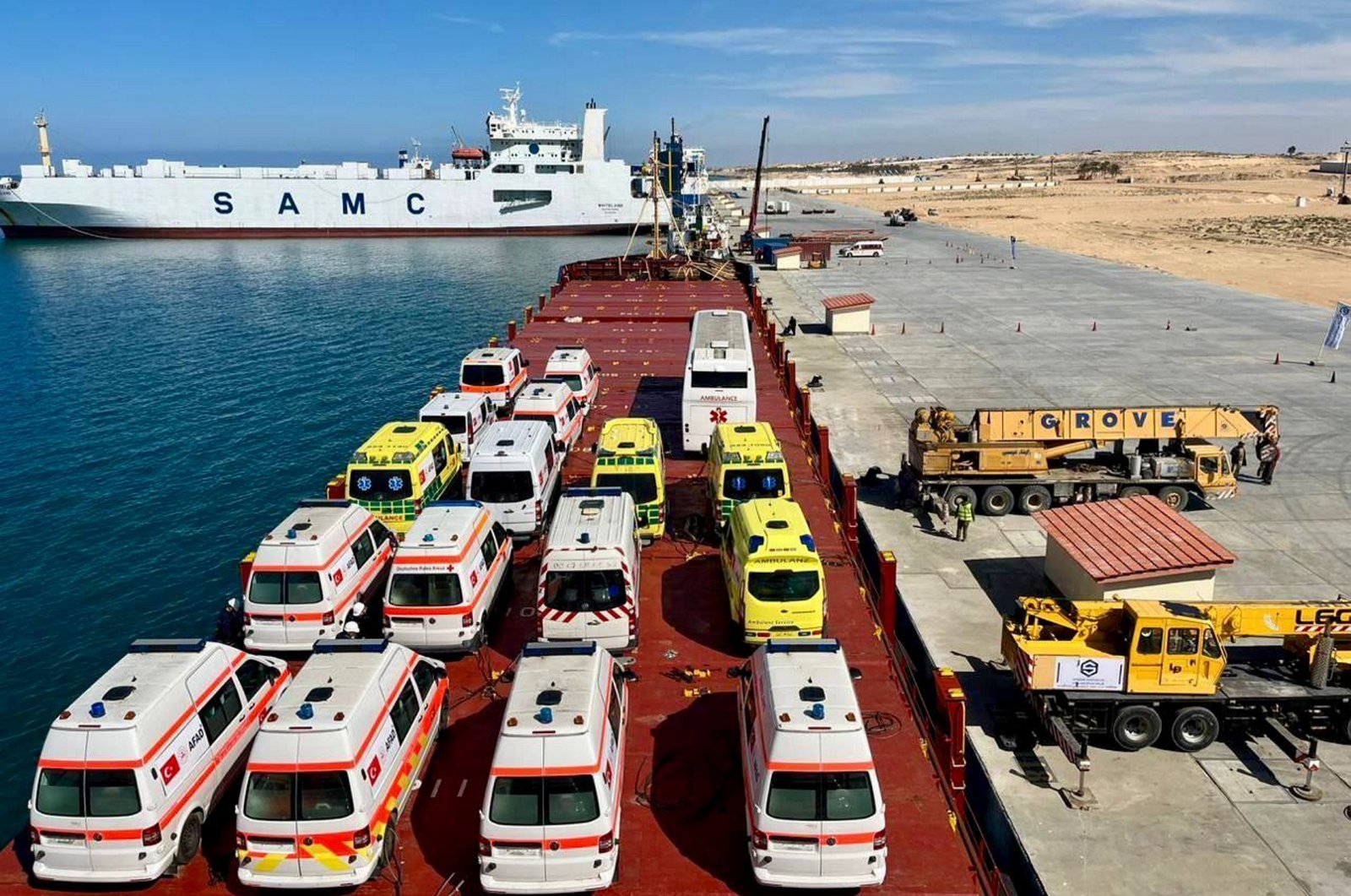 Ambulances donated by Hayrat Humanitarian Assistance Foundation are loaded on vessels in Mersin to be sent to Gaza, Feb. 27, 2024. (AA Photo)