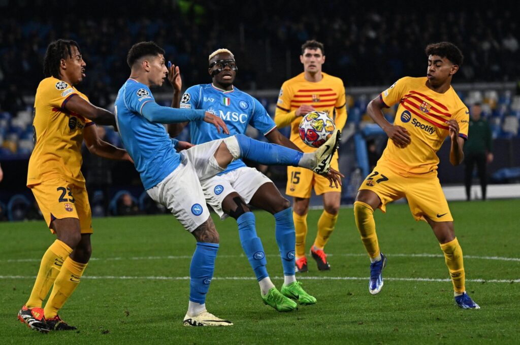 Napoli’s defender Olivera (2nd L) and Victor Osimhen (C) vie for the ball with Barcelona's Lamine Yamal (R) during the UEFA Champions League Round of 16, first leg match at Diego Armando Maradona stadium, Naples, Italy, Feb. 21, 2024. (EPA Photo)