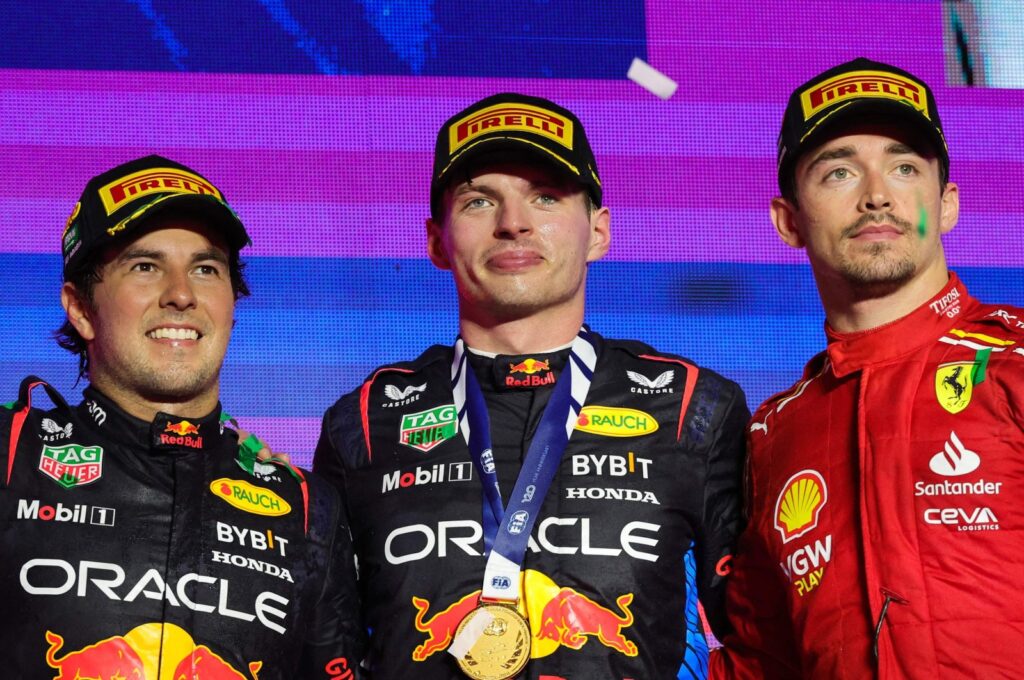 Red Bull Racing's Dutch driver Max Verstappen (C) celebrates winning the Saudi Arabian Formula One Grand Prix alongside Sergio Perez (L) and Charles Leclerc during the podium ceremony at the Jeddah Corniche Circuit, Jeddah, Saudi Arabia, March 9, 2024. (AFP Photo)