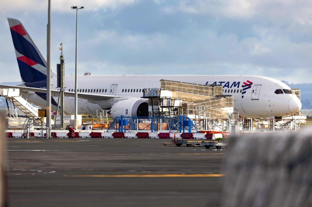 The LATAM Airlines Boeing 787 Dreamliner plane that suddenly lost altitude midflight a day earlier, dropping violently and injuring dozens of terrified travelers, is seen on the tarmac of Auckland International Airport, Auckland, New Zealand, March 12, 2024. (AFP Photo)