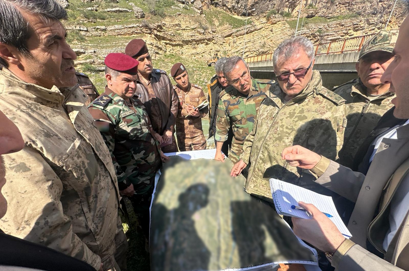 Gen. Metin Tokel (2nd R) talks to Iraqi officials in an undisclosed location in Iraq, March 12, 2024. (AA Photo)