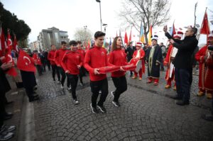 Turkish flags handed over to student-athletes commences the "Çanakkale-Ankara 27th Victory Race," Çimenlik Castle, Çanakkale, Türkiye, March 12, 2024. (AA Photo)