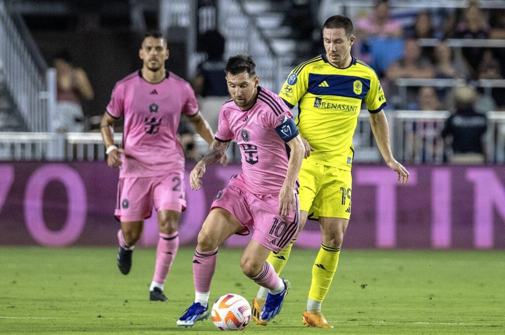 Inter Miami Lionel Messi (C) in action against Nashville SC's Alex Muyl (R) during the CONCACAF Champions Cup match, Fort Lauderdale, Florida, U.S., March 13, 2024. (EPA Photo)