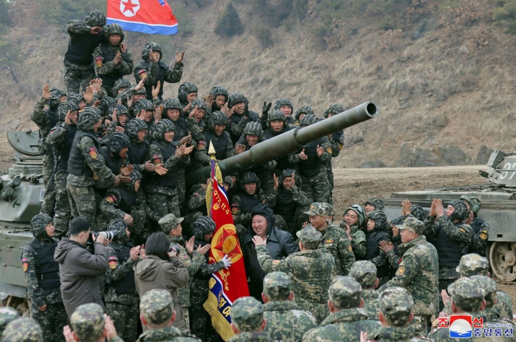 North Korean leader Kim Jong Un (Center) posing with personnel during a training competition between the combined forces of the Korean People's Army tank crews at an undisclosed location in North Korea, in this picture taken on March 13, 2024, and released by the Korean Central News Agency on March 14. (AFP Photo)