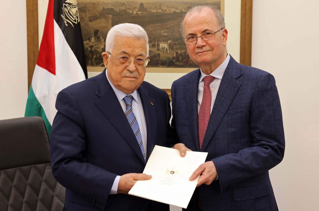 This handout picture provided by the Palestinian Authority's Press Office (PPO) shows Palestinian President Mahmoud Abbas (L) posing with the newly appointed Palestinian Prime Minister Mohammad Mustafa in Ramallah on March 14, 2024. (AFP Photo)