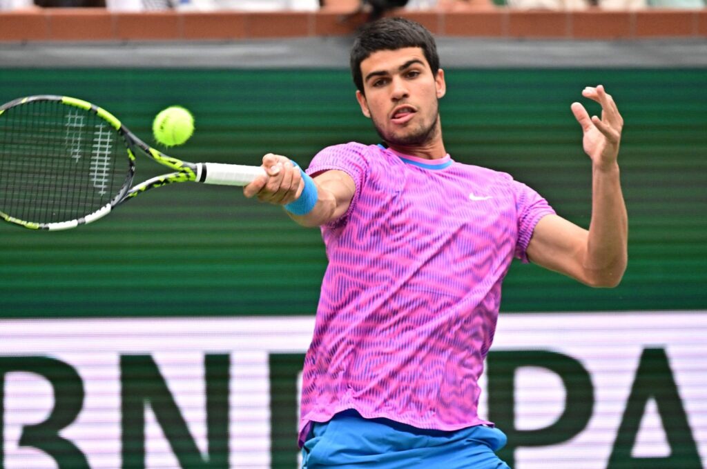 Spain's Carlos Alcaraz hits a forehand return to Italy's Jannik Sinner before a rain delay during their ATP-WTA Indian Wells Masters semifinal match, Indian Wells Tennis Garden, Indian Wells, U.S., March 16, 2024. (AFP Photo)