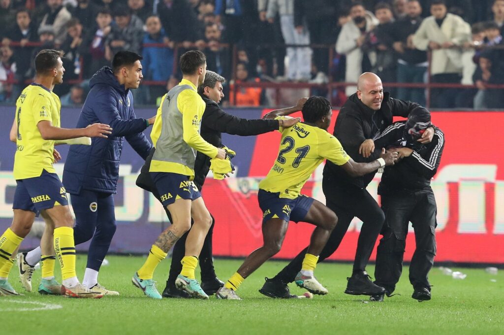A Trabzonspor fan (R) attacks Fenerbahçe players after the Süper Lig match, Trabzon, Türkiye, March 17, 2024. (EPA Photo)