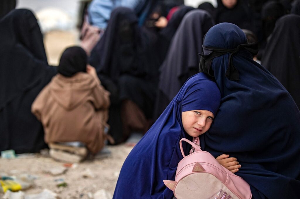 A girl hugs her mother at the al-Hol camp, in northeastern al-Hassakeh Governorate, Syria, Oct. 11, 2023. (AFP Photo)