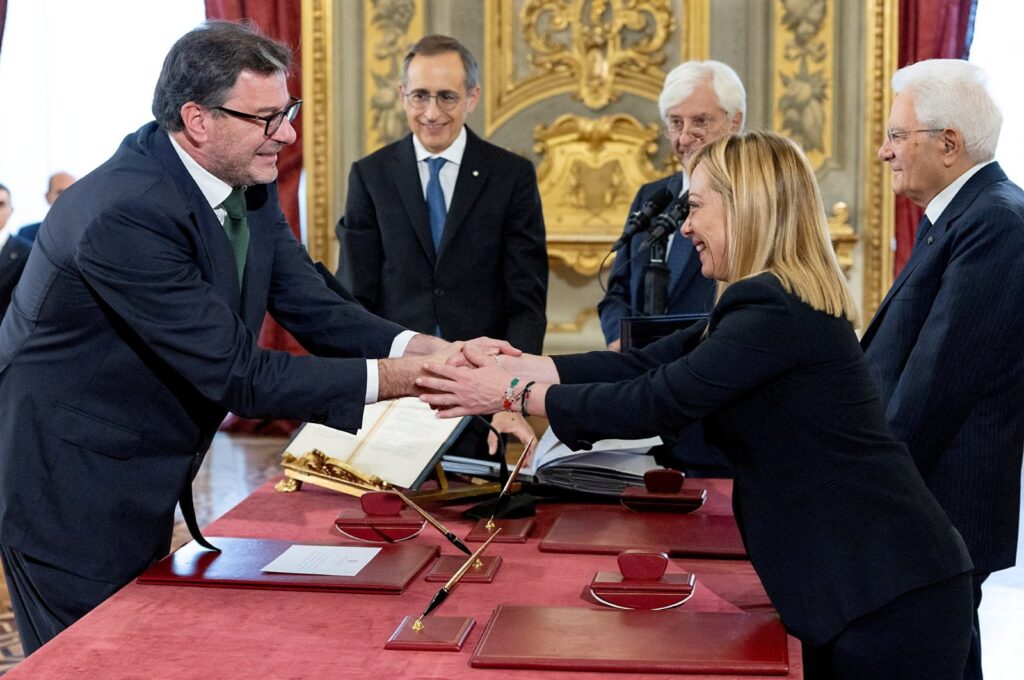 Italy's new Economy Minister Giancarlo Giorgetti shakes hands with Italian Prime Minister Giorgia Meloni during the swearing-in ceremony at the Quirinale Presidential Palace, Rome, Italy, Oct. 22, 2022. (Reuters Photo)