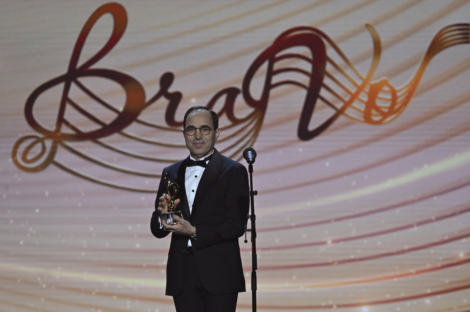 Tanju Bilgiç, Türkiye's ambassador to Moscow, receives the award for AKM at the 6th BraVo Music Awards, Moscow, Russia, March, 19, 2024. (AA Photo)