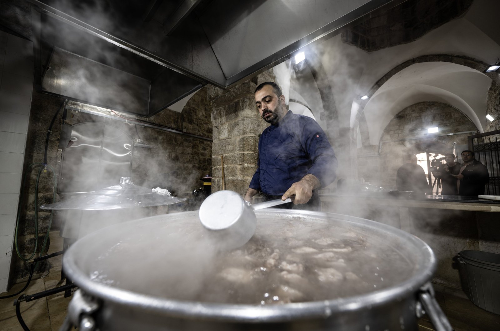 A staff member cooks a meal as part of the Ramadan aid efforts at the Haseki Sultan Lodge, Jerusalem, Palestine, March 21, 2024. (AA Photo)