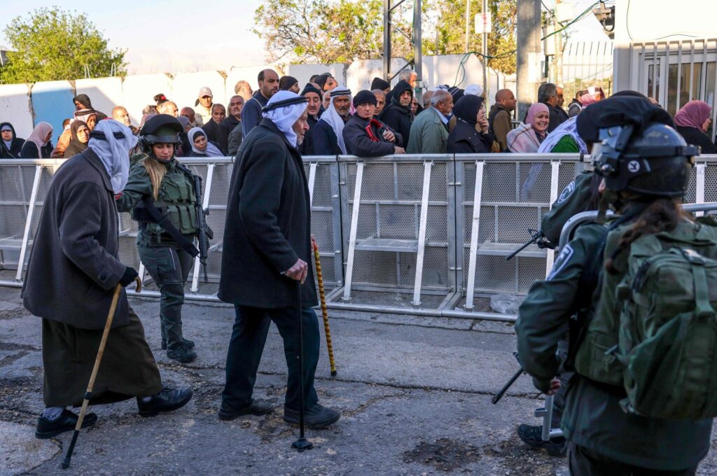 Palestinian Muslims cross an Israeli checkpoint in Bethlehem as worshippers head to Jerusalem to try and attend the second Friday prayers of Islam's holy fasting month of Ramadan, Al-Aqsa Mosque, West Bank, occupied Palestine, March 22, 2024. (AFP Photo)