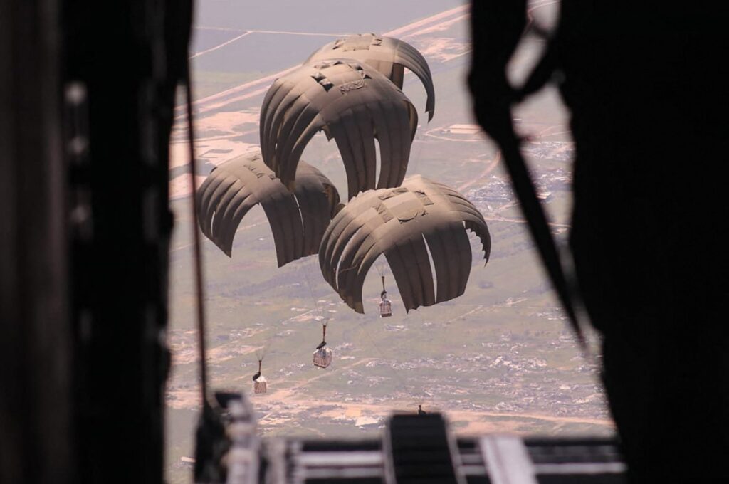 Humanitarian aid being airdropped from a military aircraft over the Gaza Strip amid the ongoing Israel-Palestine conflict, March 21, 2024. (Jordanian army Handout via AFP)