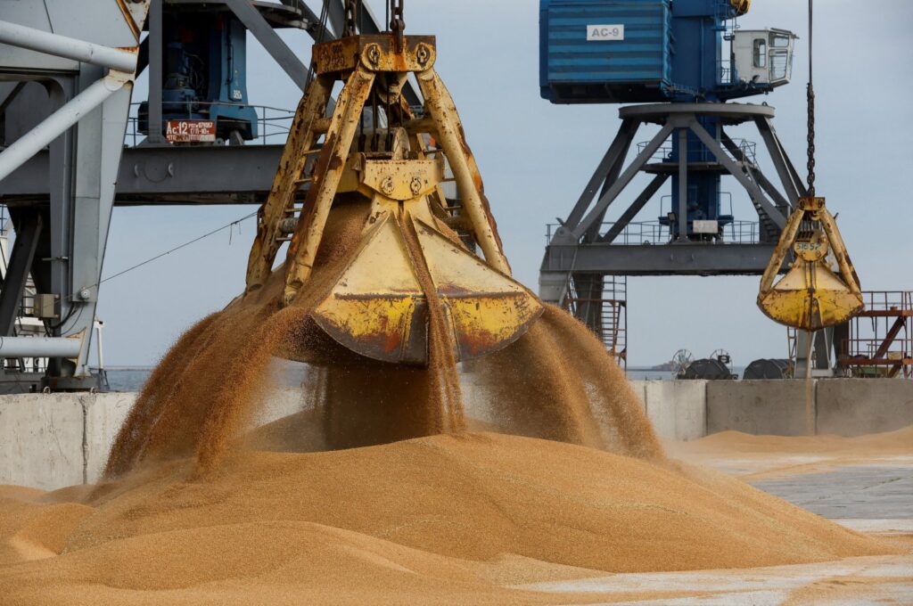 A crane loads wheat grain into the cargo vessel Mezhdurechensk before its departure for the Russian city of Rostov-on-Don in the course of the Russia-Ukraine conflict in the port of Mariupol, Ukraine, Oct. 25, 2023.