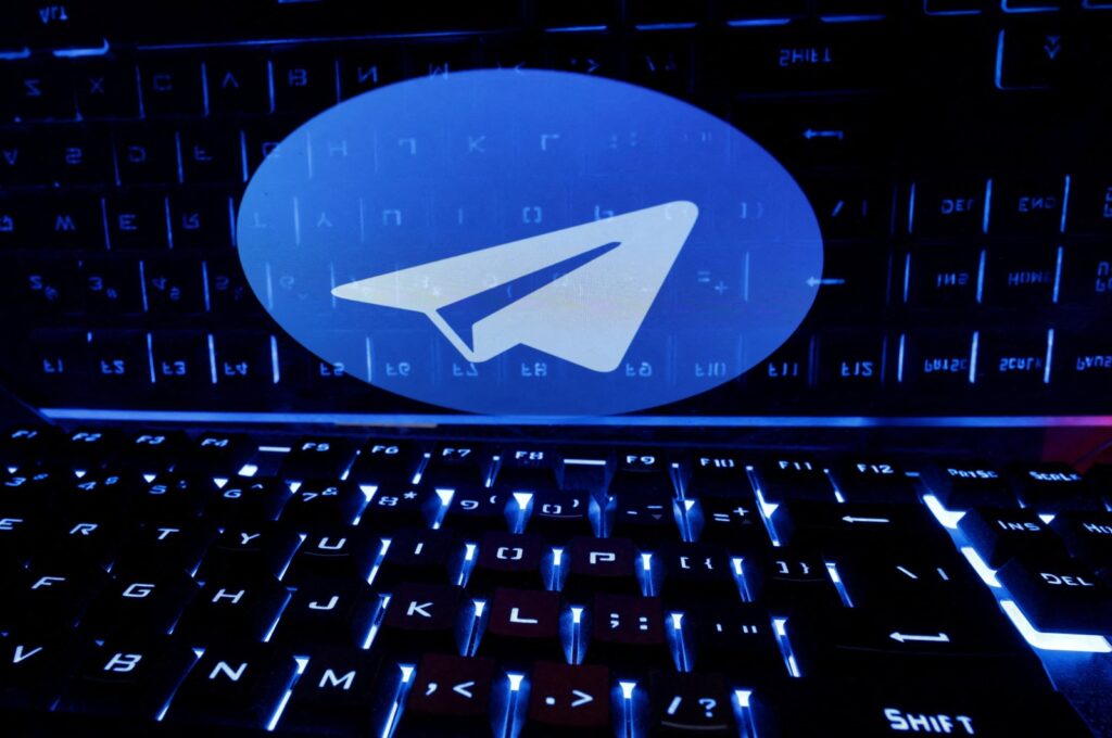 A keyboard is placed in front of a displayed Telegram logo in this illustration taken on Feb. 21, 2023. (Reuters Photo;)