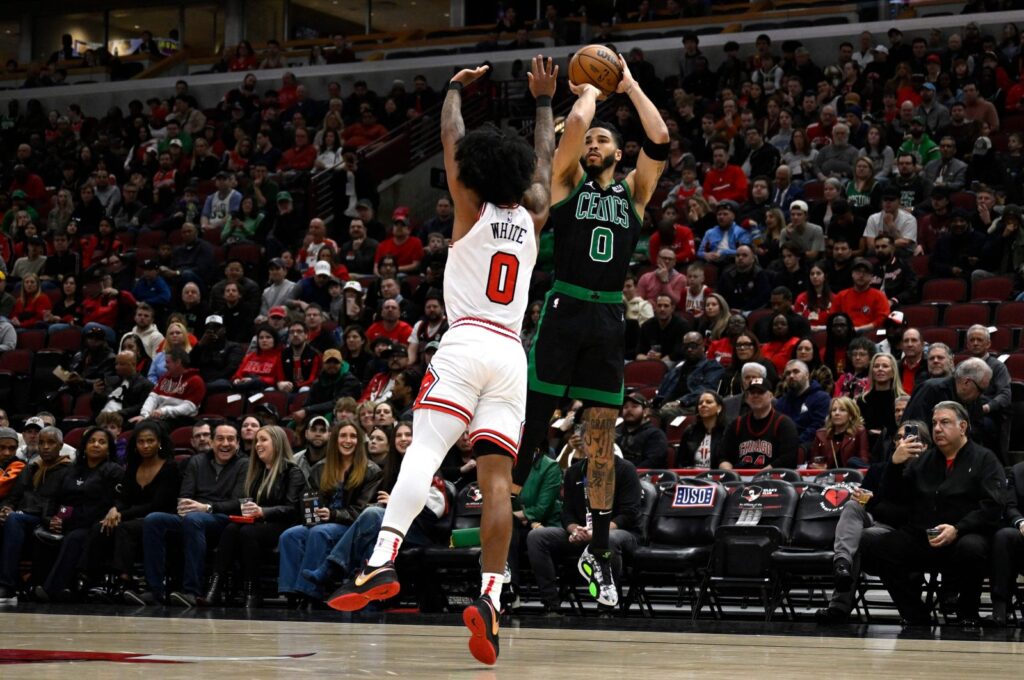 Celtics Jayson Tatum (R) shoots against Bulls' Coby White during an NBA game in Chicago, Illinois, March 23, 2024. (AFP Photo)