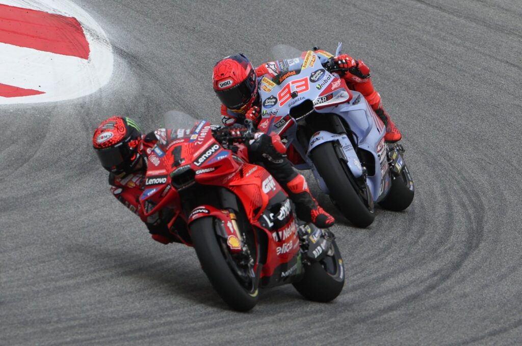 Francesco Bagnaia (L) and Marc Marquez in action during the MotoGP race of the Motorcycling Grand Prix of Portugal, Portimao, Portugal, March 24, 2024. (EPA Photo)