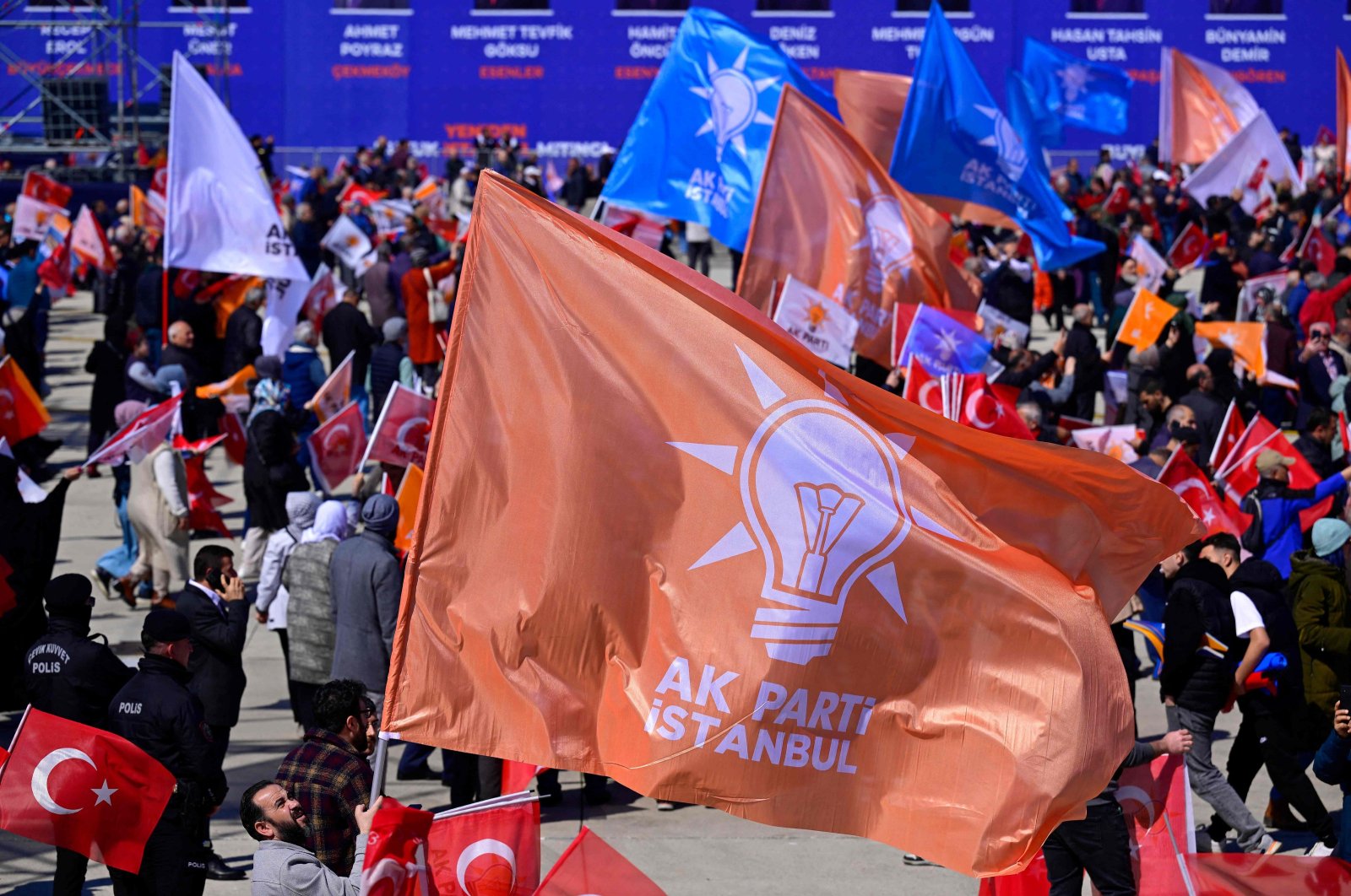 Supporters of the Justice and Development Party (AK Party) hold the party's flags as they attend an election campaign rally ahead of the March 31 municipal elections, Istanbul, Türkiye, March 24, 2024. (AFP Photo)