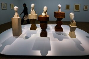 A woman passes artworks by Romanian sculptor Constantin Brancusi, put on display as part of an exhibition on Brancusi at the Centre Pompidou, Paris, France, March 26, 2024. (EPA Photo)