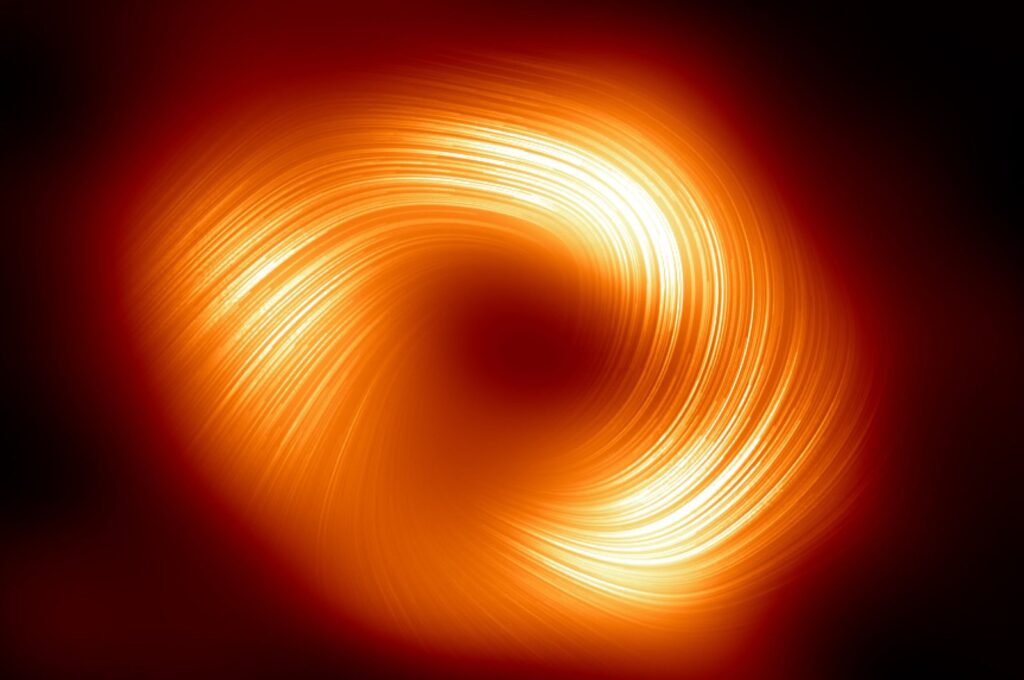 The polarized view of the Milky Way black hole, with lines marking the orientation of polarization related to the magnetic field around the shadow of the black hole, March 27, 2024. (The European Southern Observatory Handout via AFP)