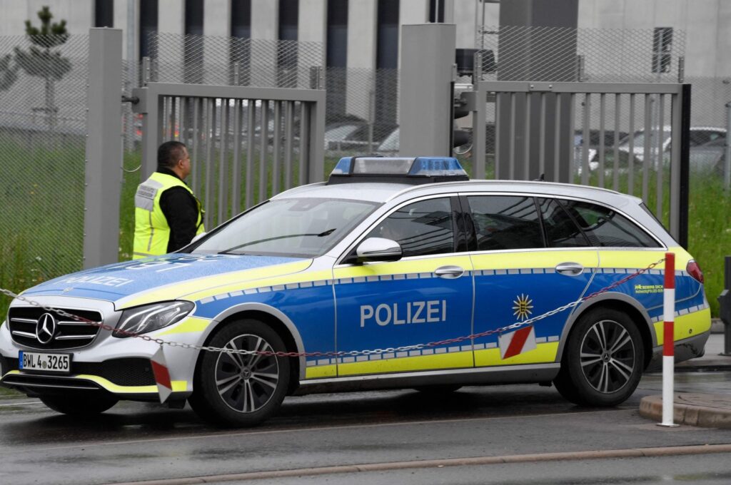 A police car leaves the grounds of Factory 56 at the plant of German car maker Mercedes-Benz in Sindelfingen, southern Germany after shots were fired at the plant on May 11, 2023. (AFP Photo)