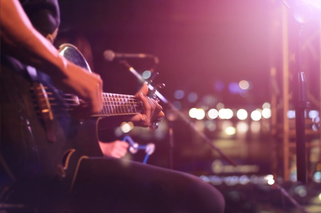 Fingers dancing across frets, the guitar whispers stories of passion and rebellion. (Shutterstock Photo)