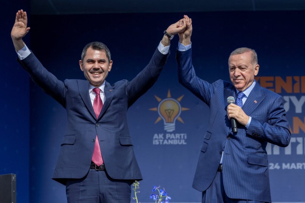 President Recep Tayyip Erdoğan (R) and Murat Kurum, mayoral candidate of the ruling Justice and Development Party (AK Party), greet their supporters during a rally ahead of the local elections in Istanbul, Türkiye, March 24, 2024. (Reuters Photo)