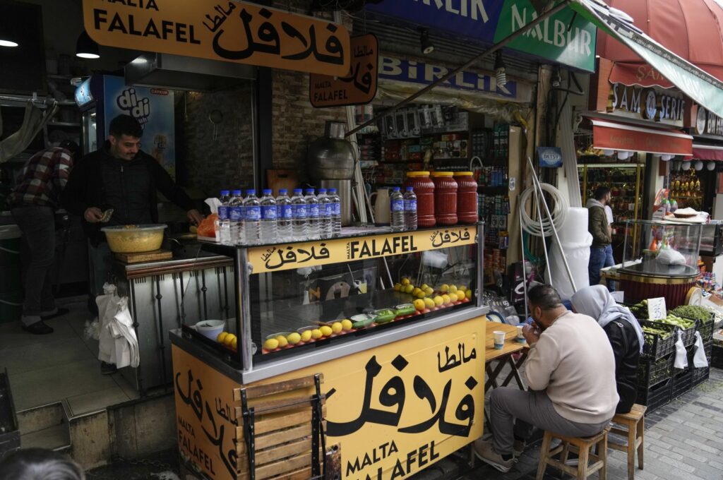 Costumers eat in a Syrian restaurant at the Fatih district of Istanbul, Türkiye, April 29, 2023. (AP Photo)