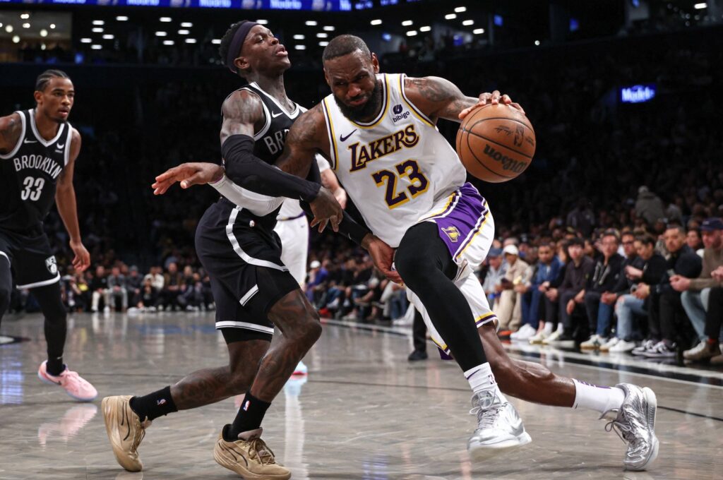 Los Angeles Lakers' LeBron James (R) dribbles against Brooklyn Nets' Dennis Schroder during the second half at Barclays Center, Brooklyn, New York, U.S., March 31, 2024. (Reuters Photo)