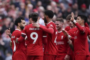 Mohamed Salah (L) celebrates with Liverpool teammates after scoring the 2-1 lead during the English Premier League match against Brighton & Hove Albion, Liverpool, U.K., March 31, 2024.  (EPA Photo)