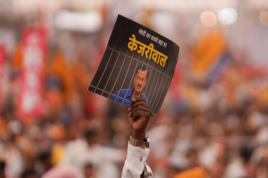 Supporters of India's opposition coalition displays a placard with a message on Delhi Chief Minister Arvind Kejriwal, New Delhi, India, March 31, 2024. (AFP Photo)