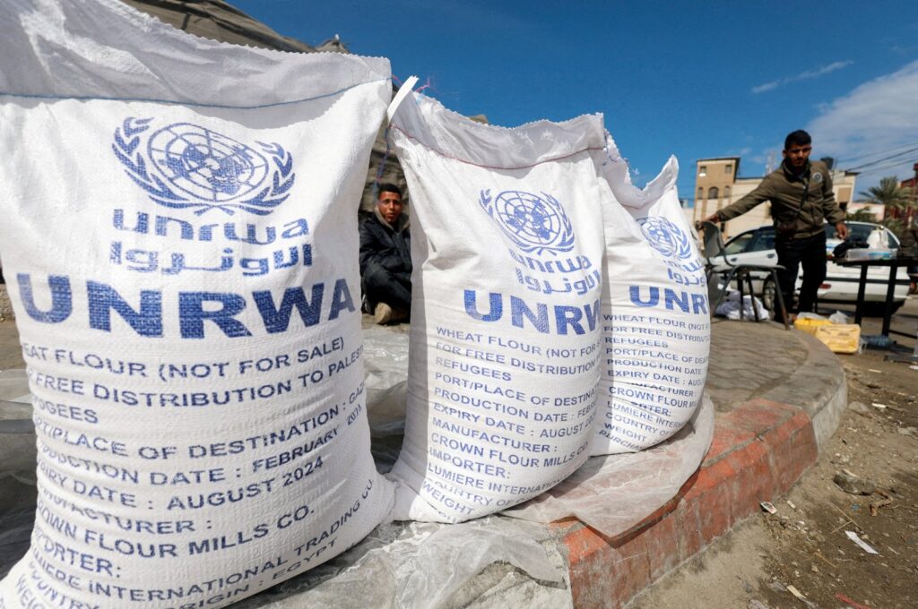 Displaced Palestinians wait to receive United Nations Relief and Works Agency for Palestine Refugees in the Near East (UNRWA) aid, Rafah, Gaza Strip, Palestine, March 7, 2024. (Reuters Photo)