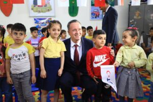 TIKA President Serdar Kayalar poses with kids during the inauguration of the Şakaik Kindergarten renovated by the Turkish Cooperation and Coordination Agency (TIKA), Baghdad, Iraq, April 2, 2024. (AA Photo)