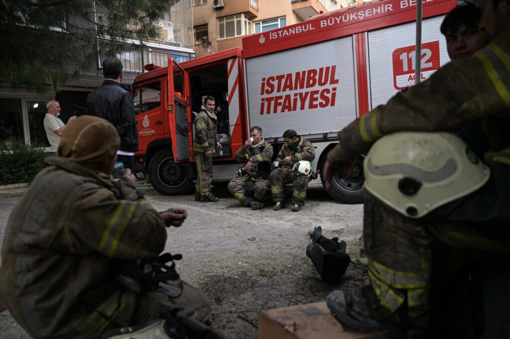 Firefighters rest during their intervention at the site of a fire in a residential building in Istanbul, Türkiye, April 2, 2024. (AFP Photo)