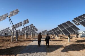 Workers walk at a solar power station in Tongchuan, Shaanxi province, China, Dec. 11, 2019. (Reuters Photo)