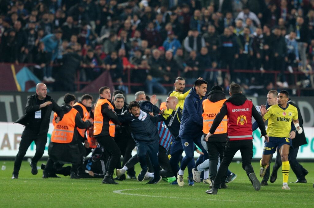 Trabzonspor fans clash with Fenerbahçe players during the Süper Lig match at the Papara Park, Trabzon, Türkiye, March 17, 2024. (DHA Photoe)