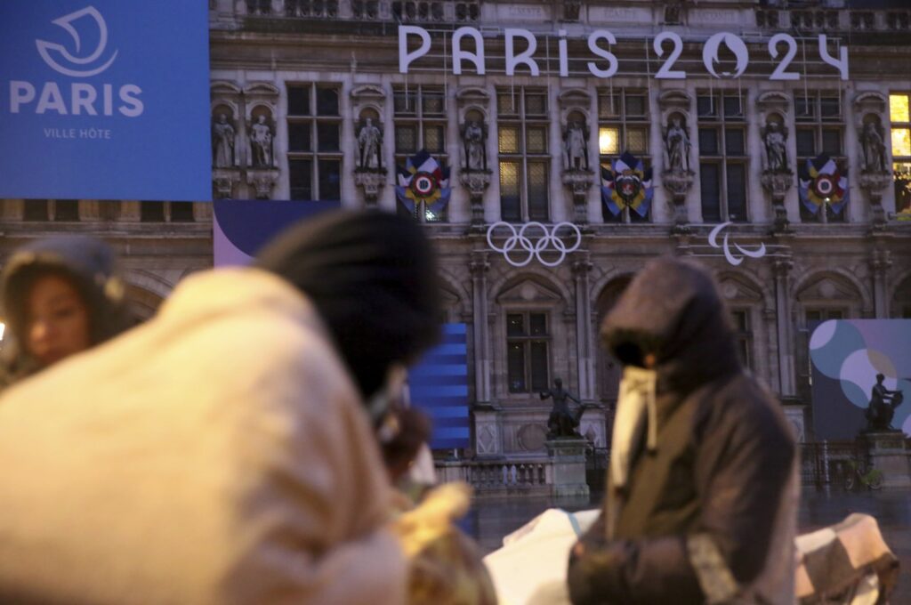 Migrants stand in front of the Paris City Hall, Paris, France, April 3, 2024. (AP Photo)