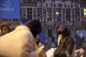 Migrants stand in front of the Paris City Hall, Paris, France, April 3, 2024. (AP Photo)