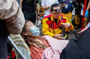 A woman receives medical attention after being rescued from Taroko National Park, following a magnitude 7.4 earthquake, Hualien, Taiwan, April 4, 2024. (EPA Photo)