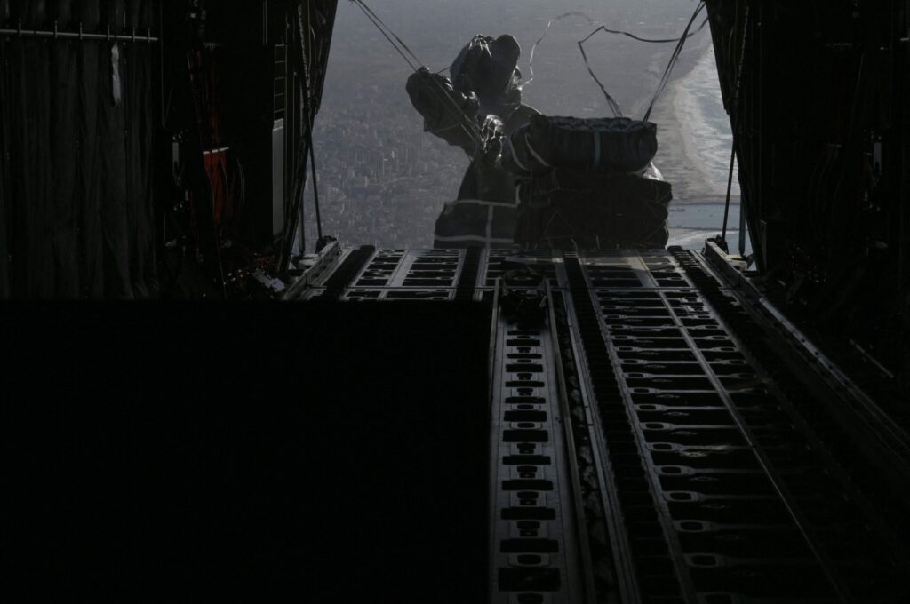 A U.S. Air Force C-130J Super Hercules conducting an airdrop of humanitarian assistance over Gaza, Palestine, March. 7, 2024. (CENTCOM Handout via AFP Photo)