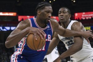 Philadelphia 76ers guard Joel Embiid (L) drives while defended by Memphis Grizzlies center Trey Jemison during an NBA game, April 6, 2024, Memphis, Tennessee, U.S. (AP Photo)