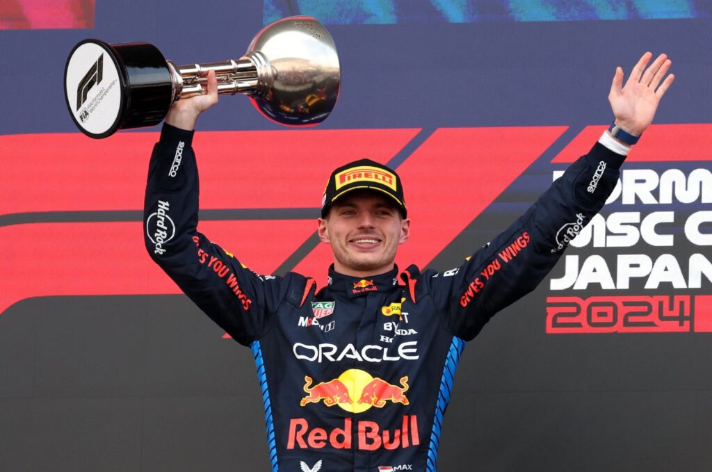Red Bull's Max Verstappen celebrates with a trophy on the podium after winning the Japanese Grand Prix, Suzuka, Japan, April 7, 2024. (Reuters Photo)