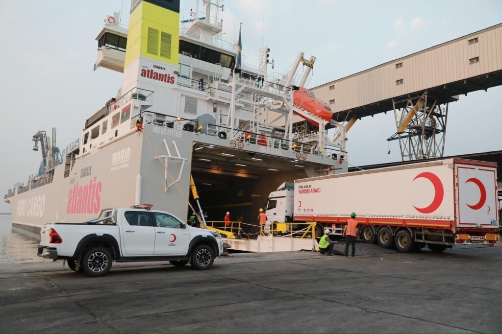 Turkish Red Crescent staff load humanitarian aid supplies onto a vessel for Gaza at the Port of Mersin, southern Mersin province, Türkiye, April 7, 2024. (AA Photo)