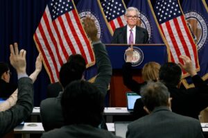 Reporters raise their hands to ask questions to Federal Reserve Chair Jerome Powell during a news conference at the bank's William McChesney Martin building in Washington, U.S., March 20, 2024. (AFP Photo)