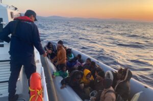 The Turkish coast guard rescuing 29 irregular migrants on a rubber boat pushed back by Greece, off the coast of Muğla province, Türkiye, April 11, 2024. (AA Photo)