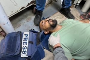 TRT Arabic journalist Sami Shehada, wounded in an Israeli strike, lies on the floor at Al-Aqsa hospital, in Deir Al-Balah in the central Gaza Strip, April 12, 2024. (Reuters Photo)