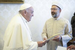 Ali Erbaş (R) presents President Recep Tayyip Erdoğan's letter to Pope Francis, Vatican City, Vatican, April 13, 2024. (AA Photo)