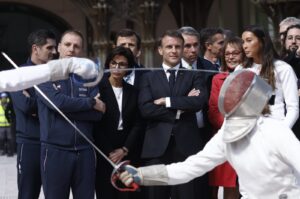 French President Emmanuel Macron (C), French Fencing champion Sara Balzer (R) and Minister of Culture of France Rachida Dati (C-L) attend a demonstration by the French fencing team during his visit to the Grand Palais, Paris, France, April 15, 2024. (EPA Photo)
